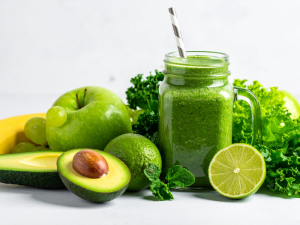 image of smoothie made with plant based milk and leafy greens